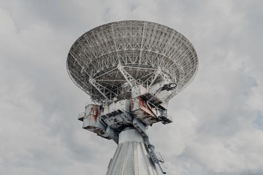 Most Distant Fast Radio Burst Traced to a Tiny Galaxy